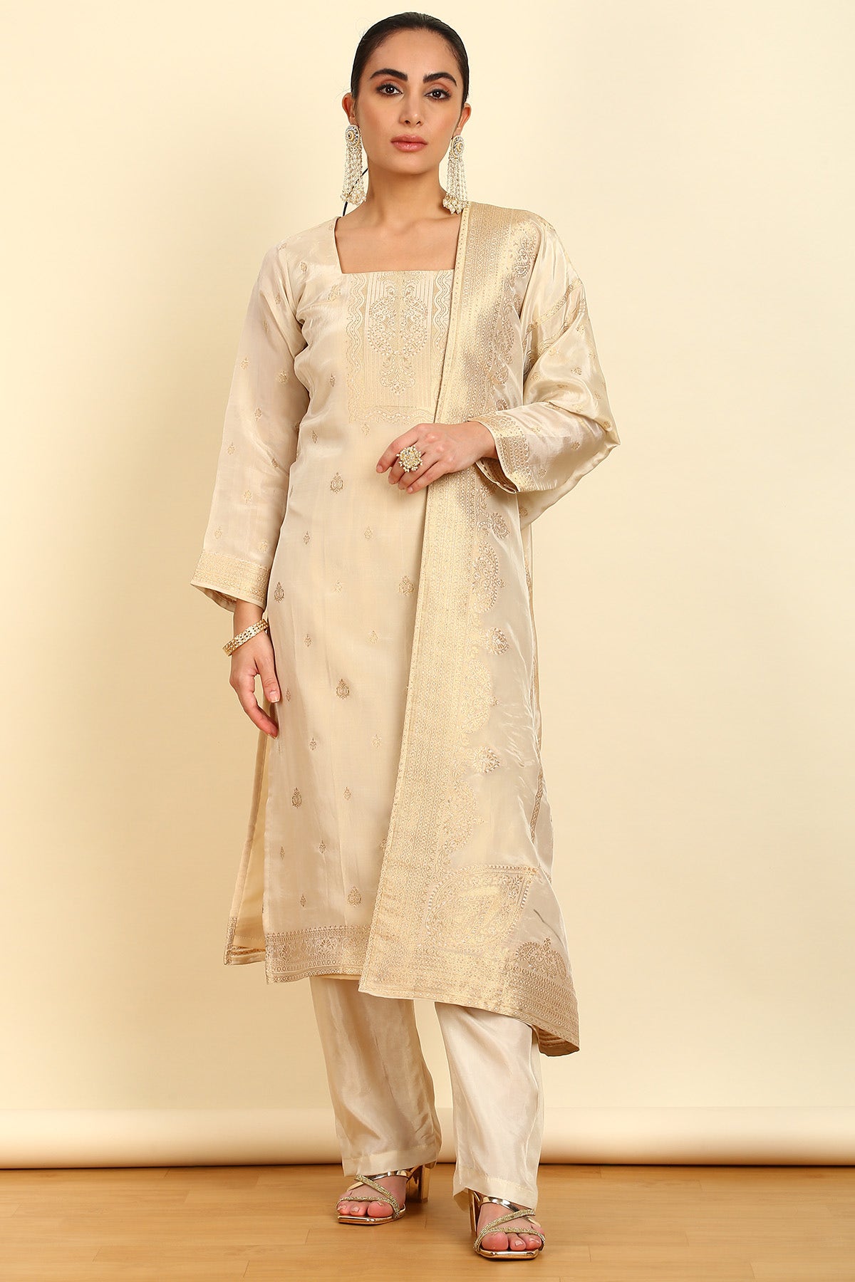 Cream color dress material shop